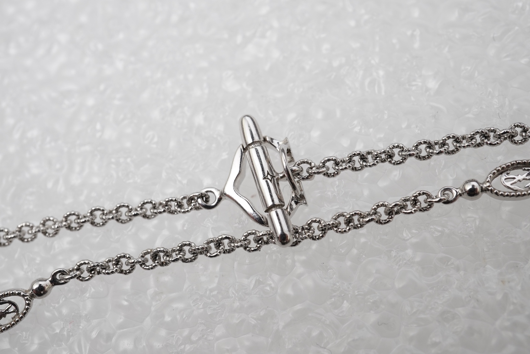 A diamond lariat necklace